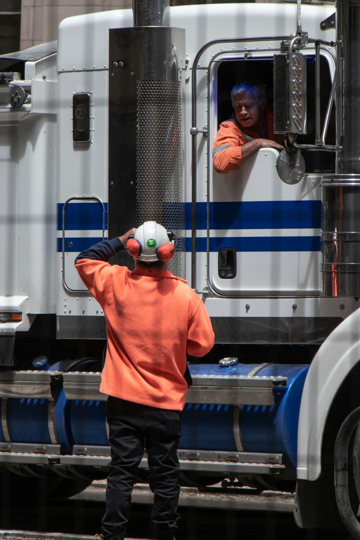 Truck drivers discussing.